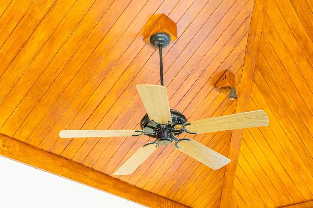 Professional Electrician Installing Ceiling Fan